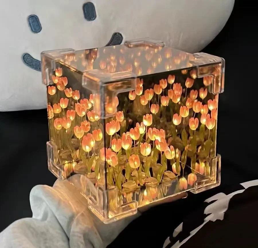 The enchanting glow of the 3D Tulip DIY Flower Cube Night Lamp in a dark room.