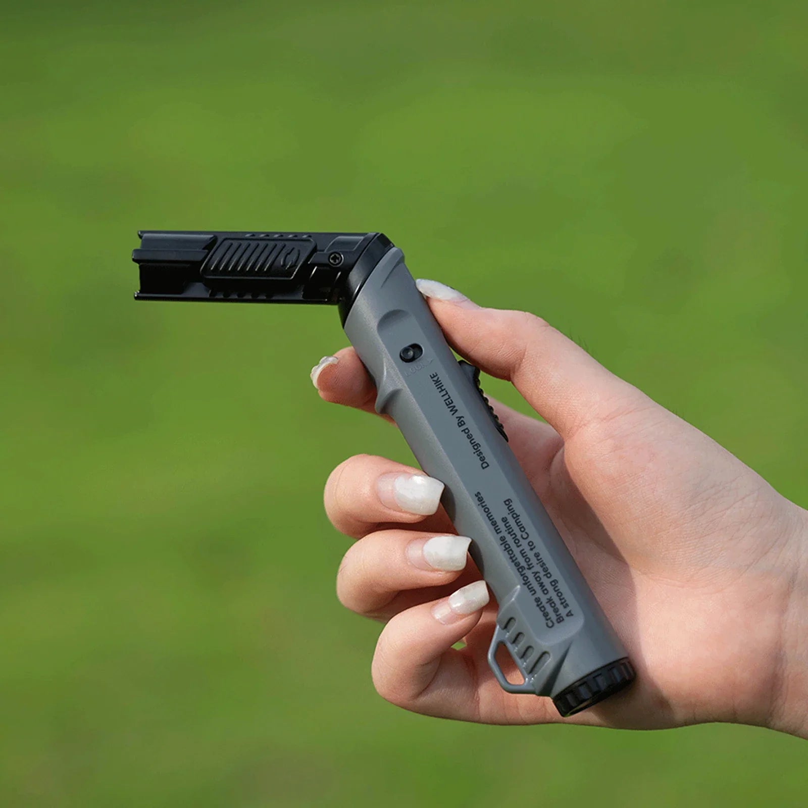 The outdoor lighter shown in a lifestyle setting, an ideal creative gadget gift.