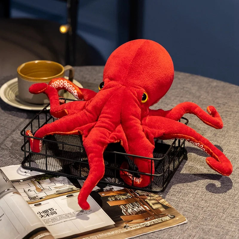 Lifestyle shot of the red octopus plush in a modern living room