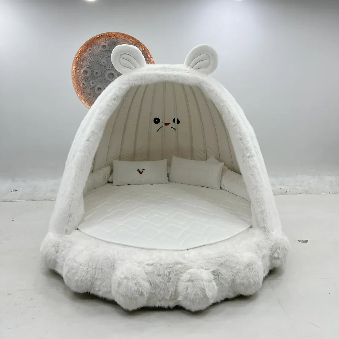 A child playing on the whimsical and fun Giant Rabbit Dreamy Oversized Bed