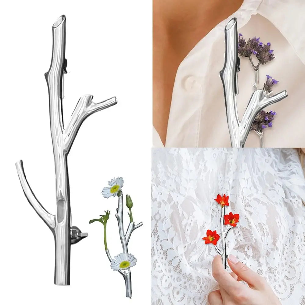 Close-up of the branch-shaped flower brooch showing its transparent design