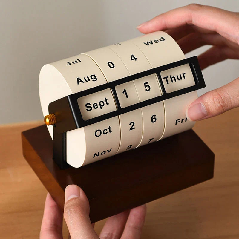 Mid-Century Rotating Wooden Perpetual Desk Calendar on a minimalist desk