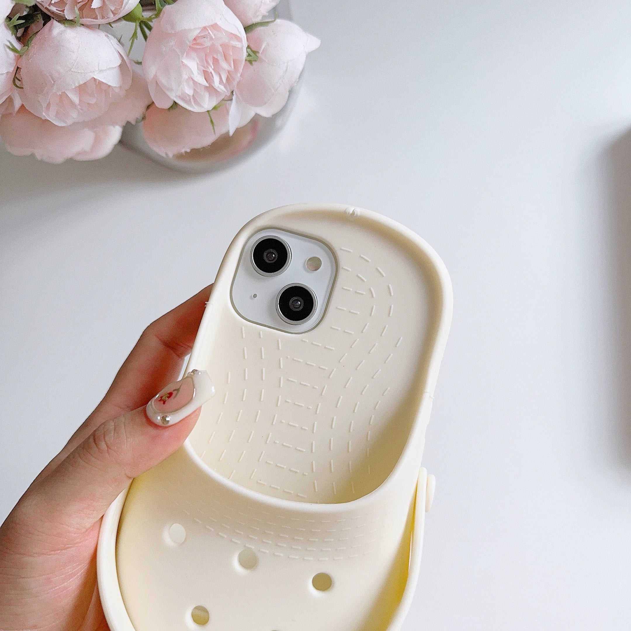 Holding the funny slipper iPhone case for a comfortable grip