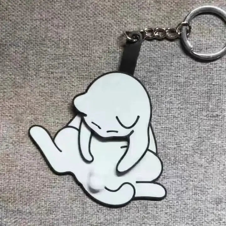 Playful Cat Quirky Keychain attached to a set of keys against a neutral background