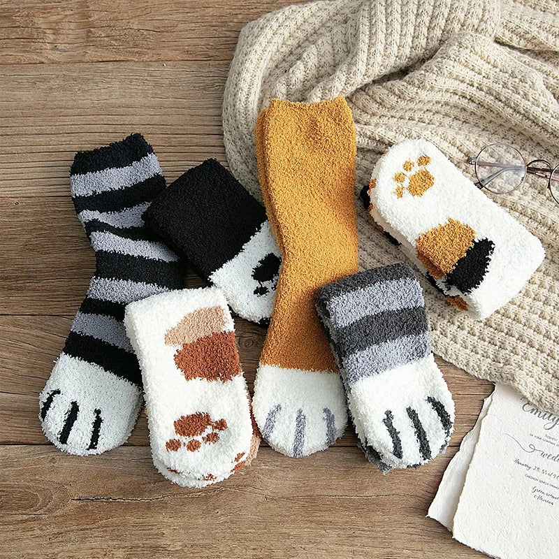 Lifestyle shot of someone relaxing at home wearing the cat paw socks