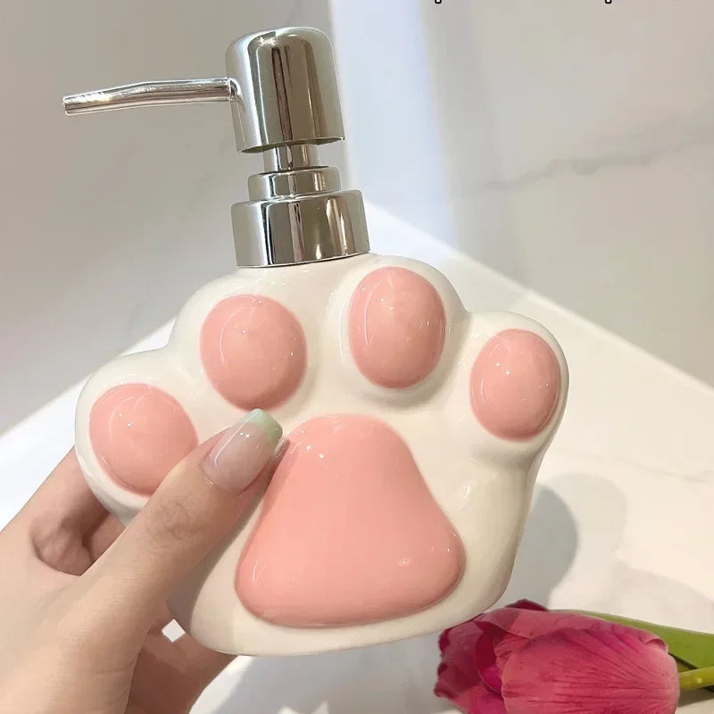 The Little Paw Soap Dispenser shown in two available sizes
