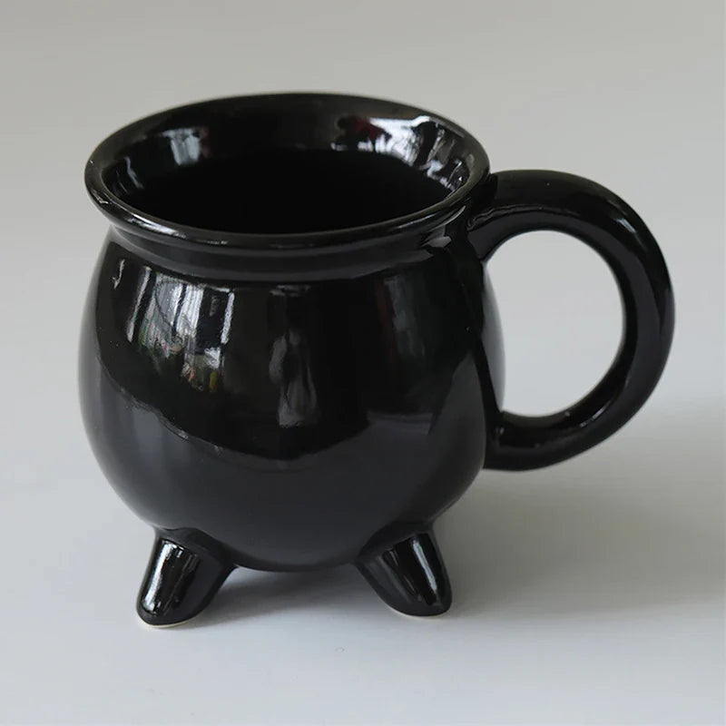 Multiple cauldron mugs showing their unique design from different angles