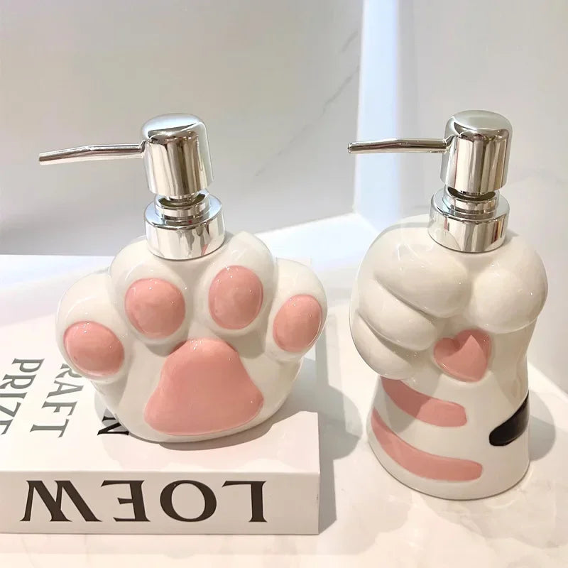 Close-up of the glossy ceramic finish on the paw-shaped soap dispenser