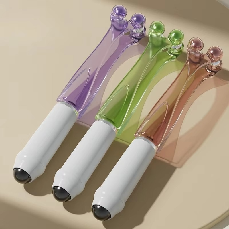 Close-up of the dual-roller design of the finger massager
