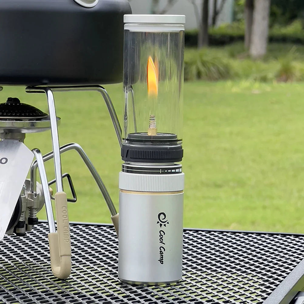 Sleek aluminum camping lantern on a wooden surface