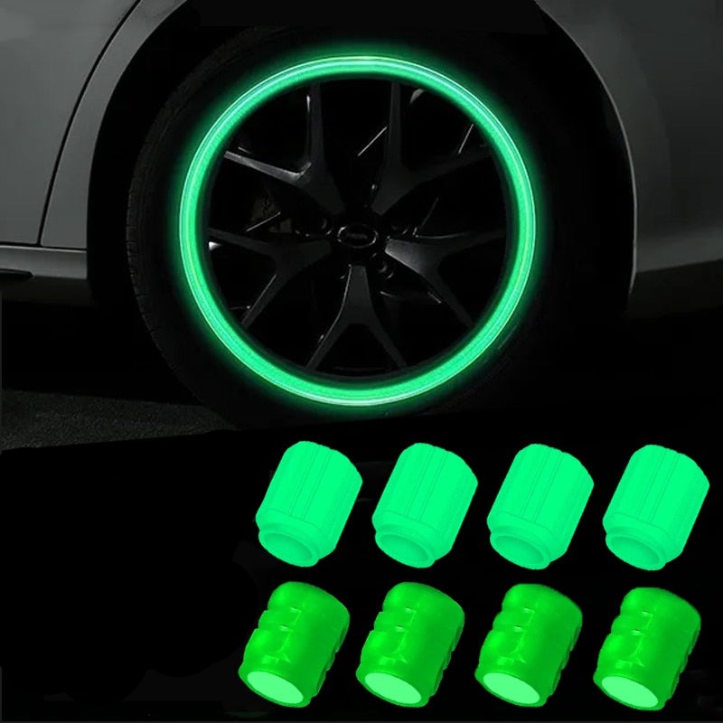 Luminous car valve caps glowing on a tire at night