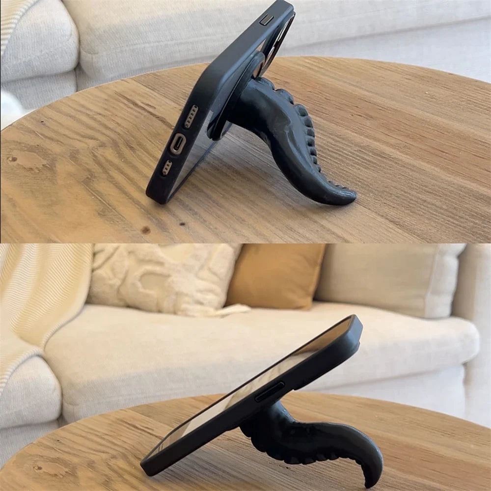 A purple octopus tentacle phone stand attached to the back of a smartphone