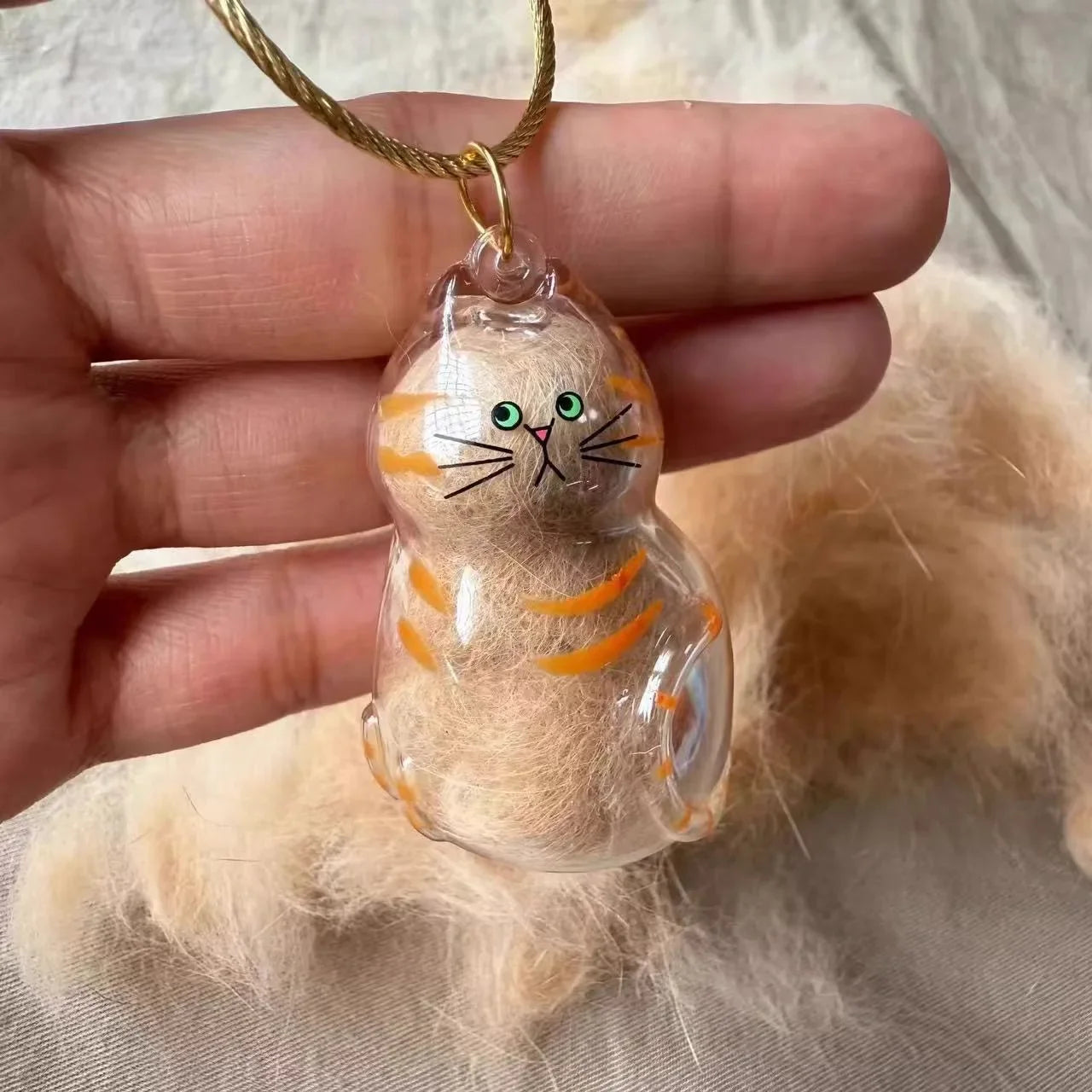 Cat Fur Keepsake Memory Pendant Necklace holding a small tuft of fur