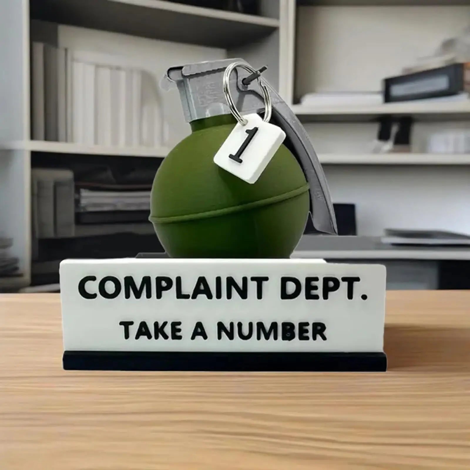 Passive-Aggressive Office Energy Desk Sign on a shelf in a home office