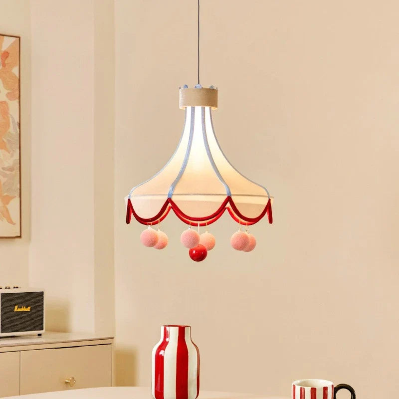 Close-up detail of the pom-pom accents on the pendant lamp gift