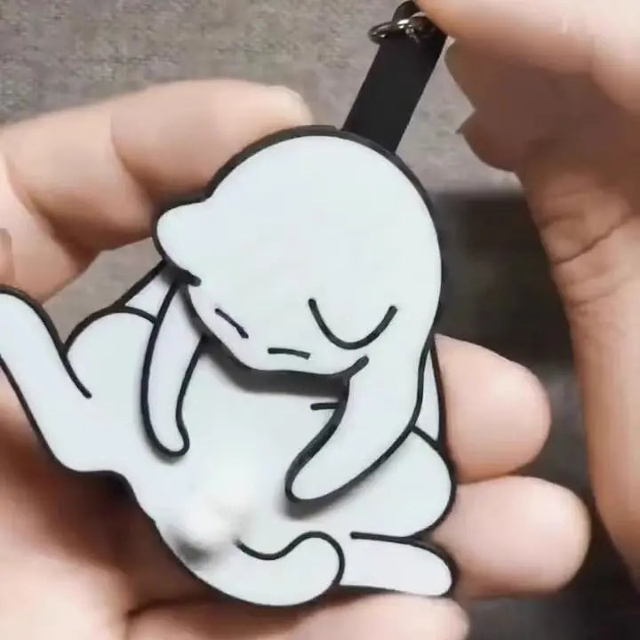 Close-up detail of the charming cat design on the quirky keychain
