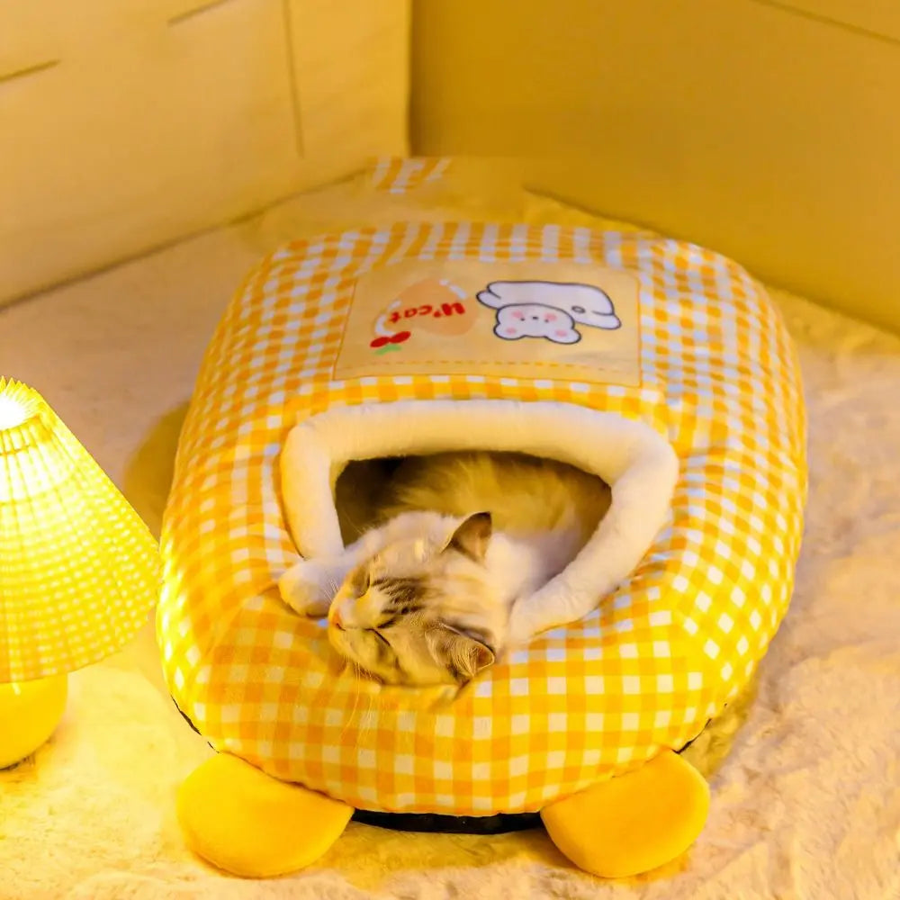 A gray cat peeking out of the cozy Snuggle Dreams Comfy Cat Bed House