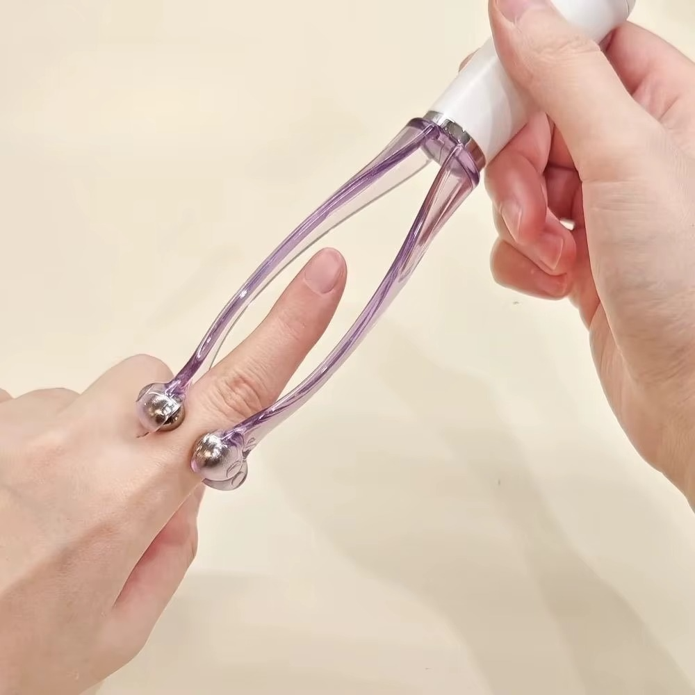 Portable finger massager showing its compact size for on-the-go use