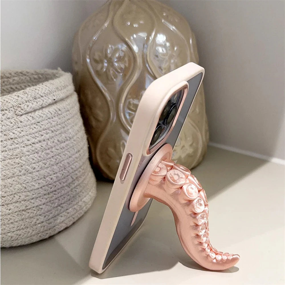 The octopus phone stand being used as a kickstand for hands-free viewing