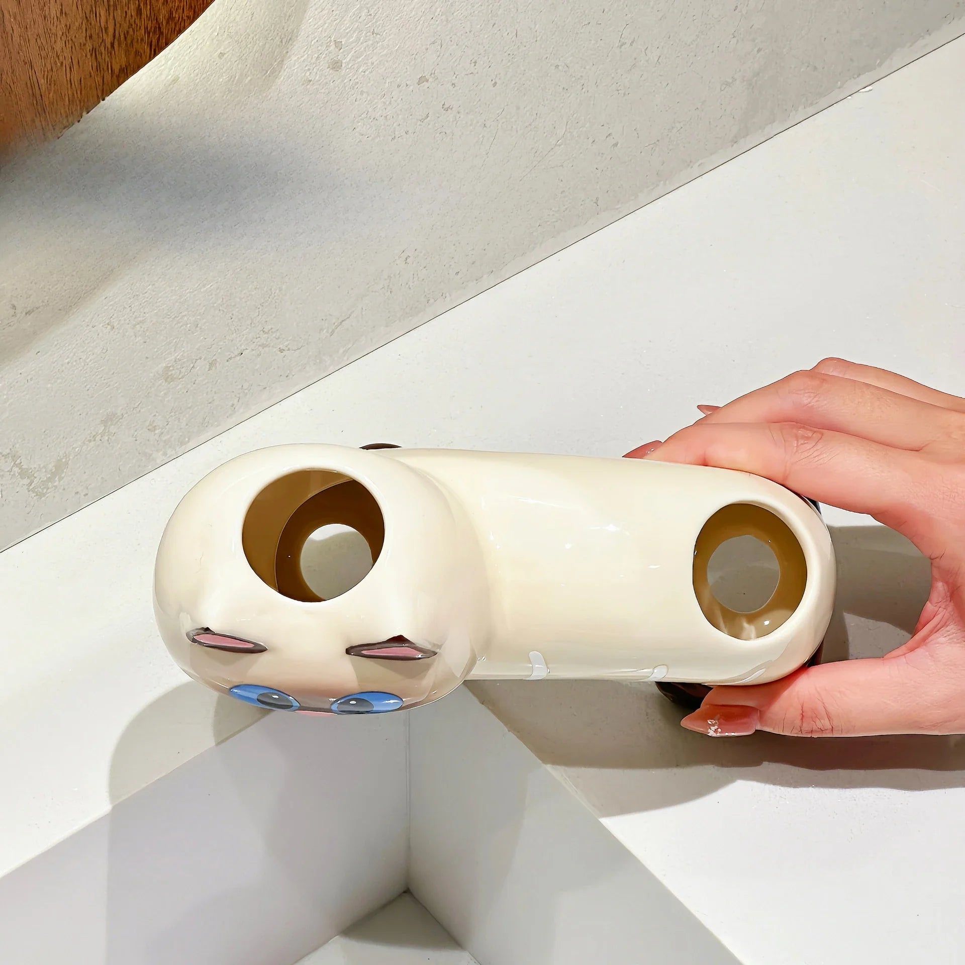 Sassy Cat holder keeping toothbrush and toothpaste tidy