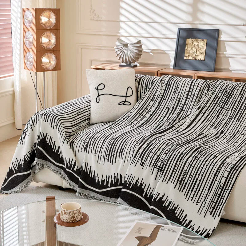 Close-up of the soft fleece and tatting-style weave of the geometric blanket