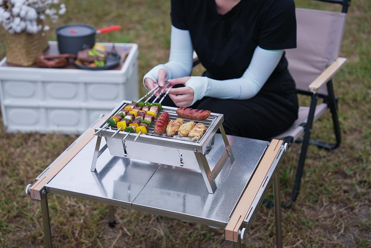Close-up of the Ultimate Camping Style Stainless Steel Foldable Grill ready for cooking
