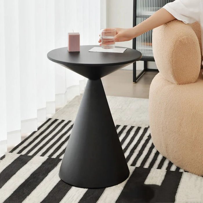 Modern metal coffee table with a glowing spherical base and minimalist design