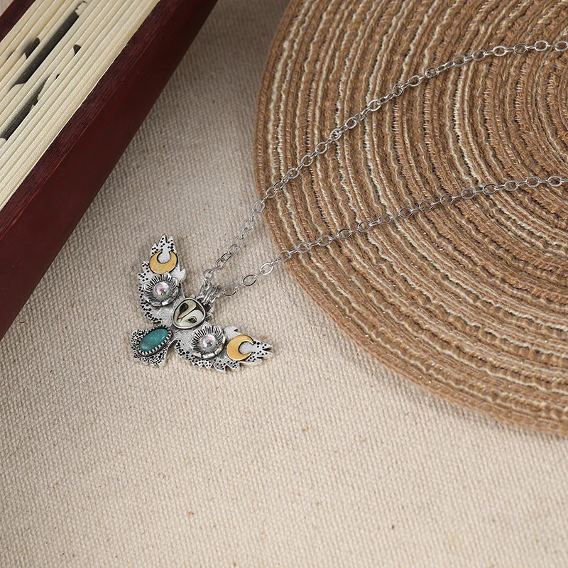 A gift-ready shot of the owl necklace, perfect for birthdays