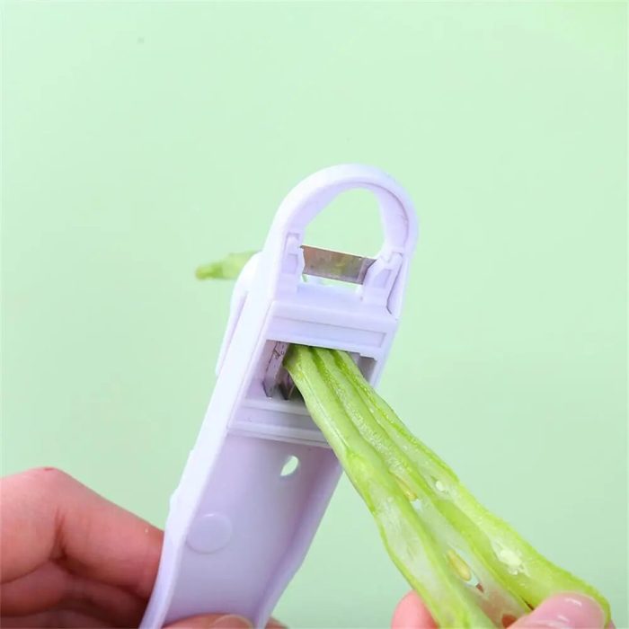 Safe multi-purpose bean and vegetable cutter