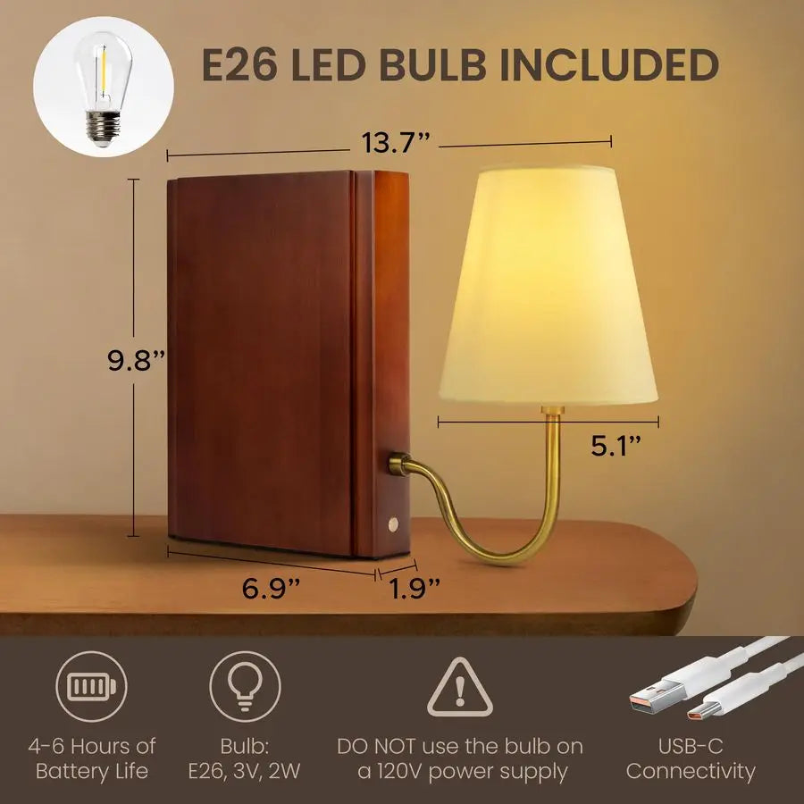 The Hidden Page Book Dimmable Table Lamp being used as a bookend on a shelf