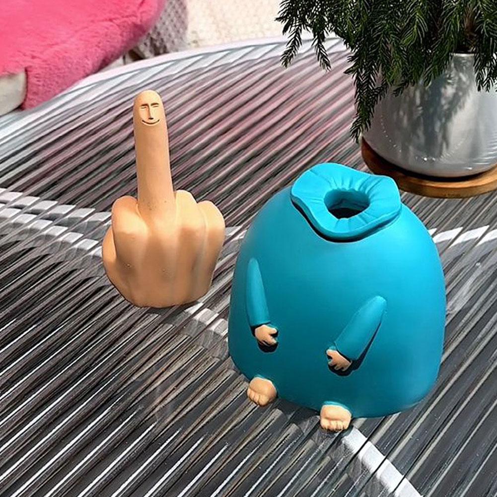 A close-up of the wooden Happy Middle Finger Funny Table Decor on a desk