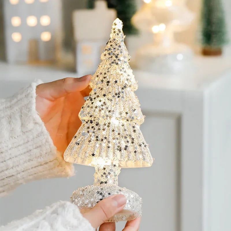 Frosted glass tree lamp adding ambiance to a living room shelf