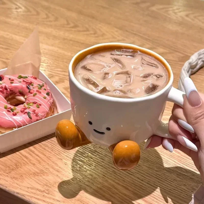 A person holding the happy face mug, a perfect gift idea for friends