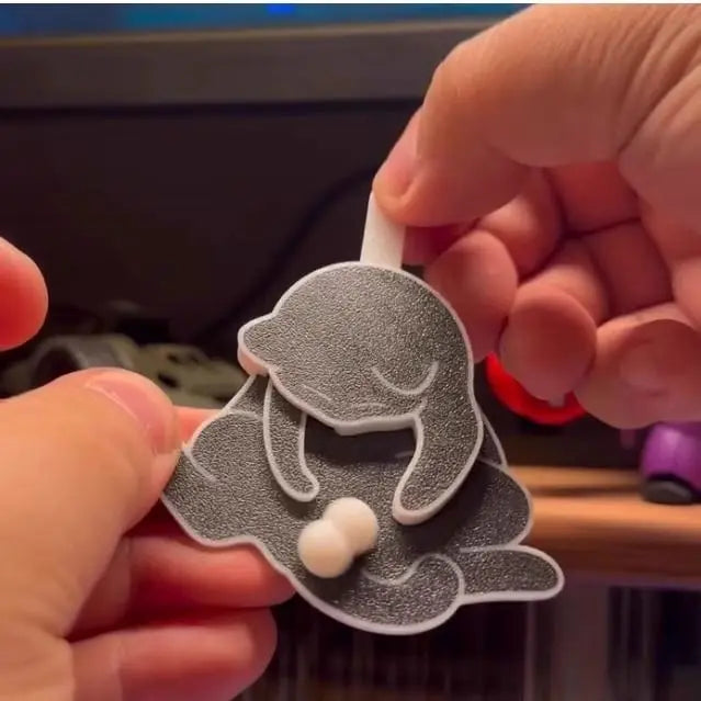 The lightweight acrylic keychain shown from a side angle to display its slim profile