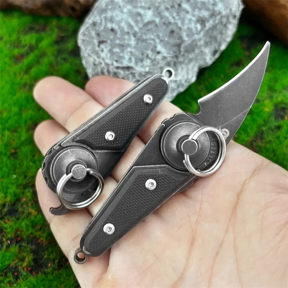 Close-up of the claw knife's ergonomic handle and folding mechanism