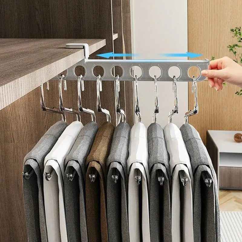 A person easily accessing clothes on the Slide Hang Retractable Closet Hanger Rack