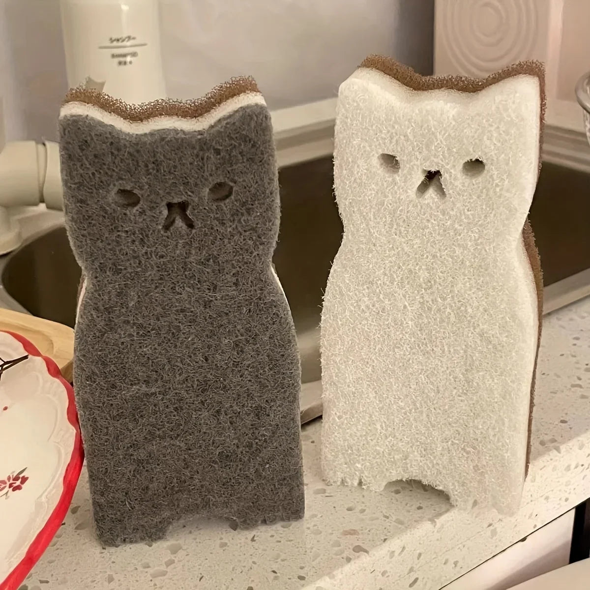 A set of four colorful cat sponges as a quirky gift idea for friends