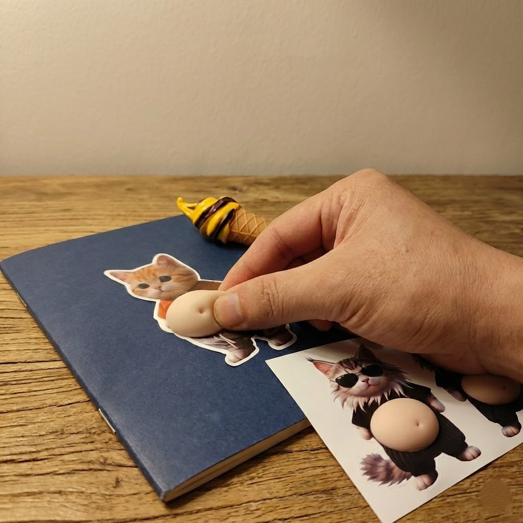 Close-up of the soft, squeezable belly of the cat sticker for stress relief