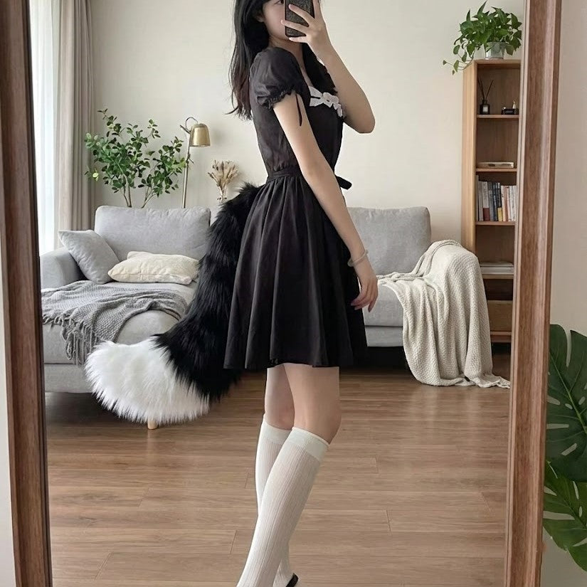 Woman wearing the Fox Tail Adjustable Belt as a playful fashion accessory.