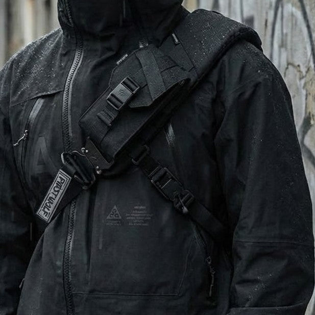 Snap-Release Chest Phone Carrier attached to a backpack strap
